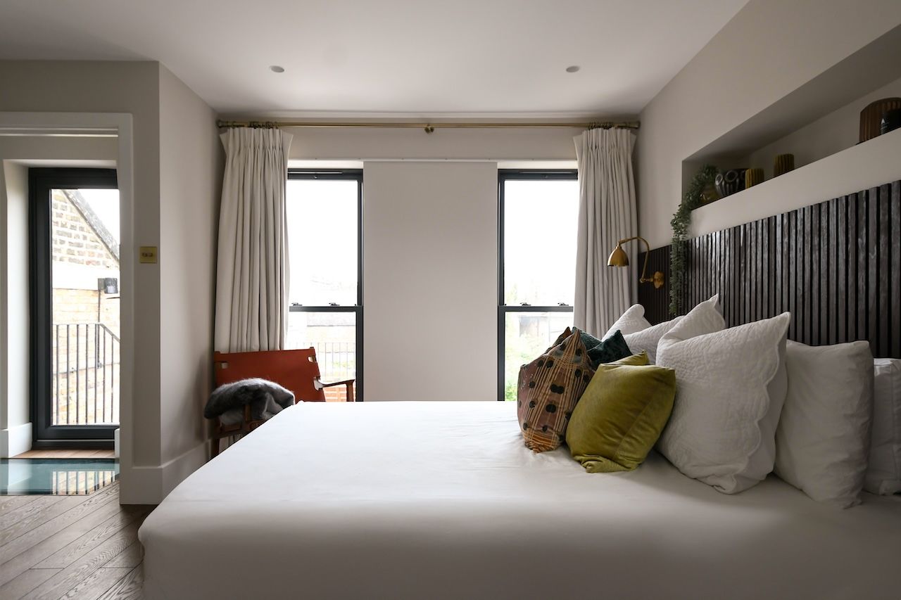 A bedroom with all the natural light and a view